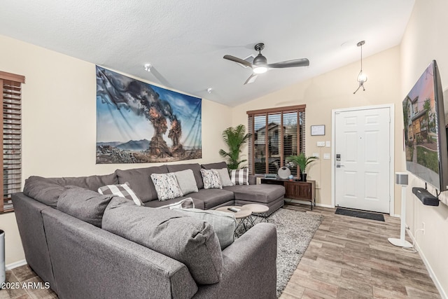 2108 E Patrick Ln, Phoenix, AZ 85024 - living area featuring a ceiling fan, wood finished floors, and vaulted ceiling