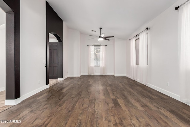 46065 W Meadows Ln, Maricopa, AZ 85139 - unfurnished room with arched walkways, ceiling fan, and wood finished floors