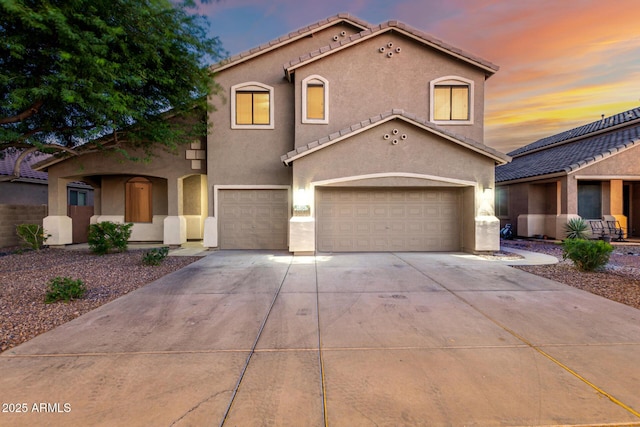46065 W Meadows Ln, Maricopa, AZ 85139 - mediterranean / spanish-style home featuring stucco siding, concrete driveway, a garage, and a tile roof
