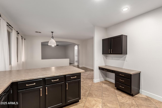 46065 W Meadows Ln, Maricopa, AZ 85139 - kitchen with arched walkways, light countertops, pendant lighting, a peninsula, and recessed lighting