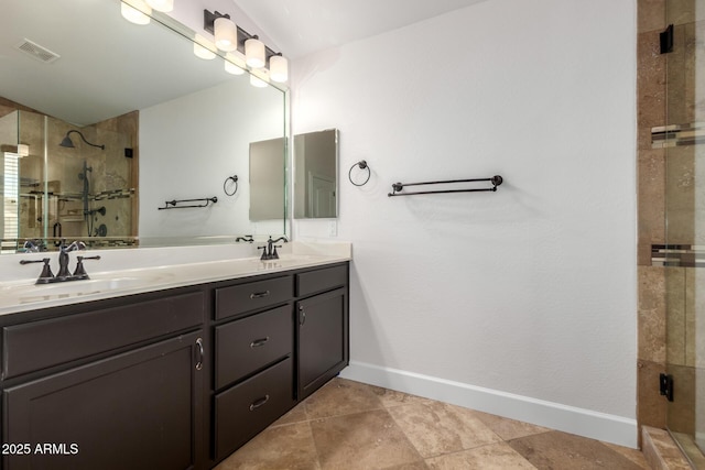 46065 W Meadows Ln, Maricopa, AZ 85139 - bathroom featuring double vanity, a shower stall, and tile patterned flooring
