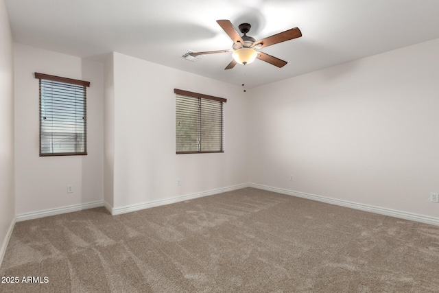 46065 W Meadows Ln, Maricopa, AZ 85139 - spare room featuring carpet flooring, a ceiling fan, and healthy amount of natural light