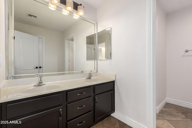 46065 W Meadows Ln, Maricopa, AZ 85139 - full bathroom with double vanity and baseboards