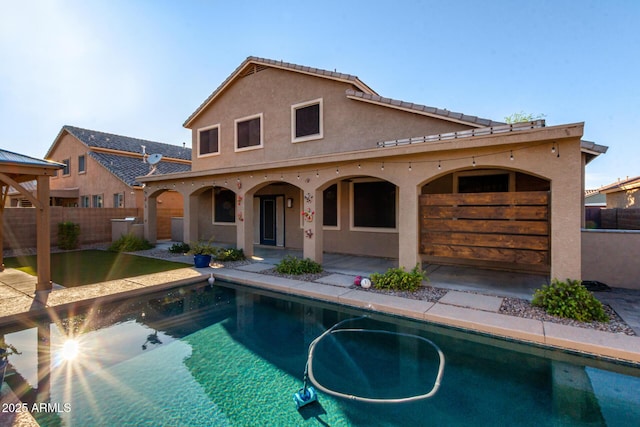 46065 W Meadows Ln, Maricopa, AZ 85139 - back of house with stucco siding and a patio area