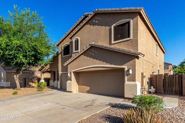 46065 W Meadows Ln, Maricopa, AZ 85139 - view of front facade with an attached garage, stucco siding, concrete driveway, and a tile roof