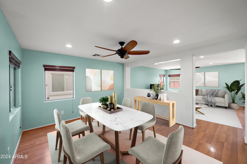 dining space featuring light wood-style floors, visible vents, a ceiling fan, and recessed lighting