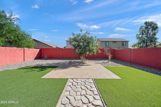 view of yard featuring a fenced backyard and a patio