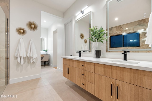 bathroom with double vanity and tile flooring