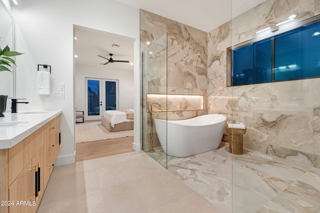 bathroom featuring hardwood / wood-style floors, ceiling fan, tile walls, and vanity