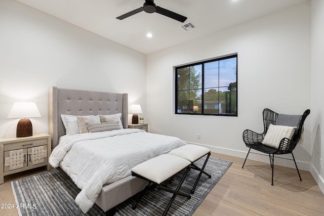 bedroom featuring light hardwood / wood-style flooring and ceiling fan