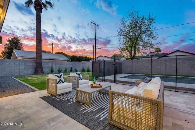 patio terrace at dusk with a pool