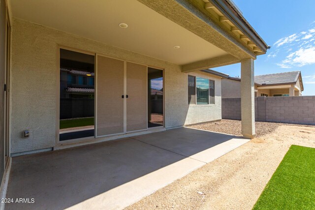 view of patio featuring fence