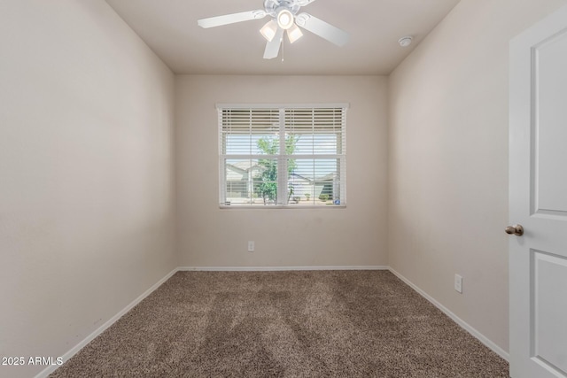 carpeted empty room with baseboards and a ceiling fan