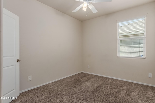 unfurnished room featuring carpet floors, a ceiling fan, and baseboards