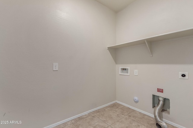 clothes washing area featuring hookup for a washing machine, hookup for an electric dryer, laundry area, baseboards, and hookup for a gas dryer