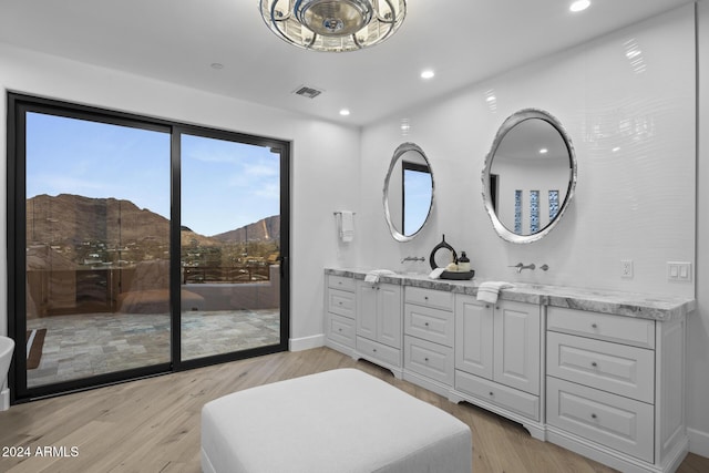 bathroom featuring hardwood / wood-style floors, a mountain view, and vanity