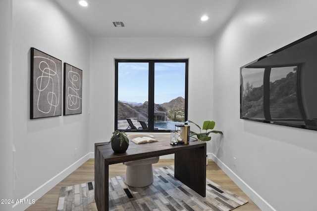 home office featuring hardwood / wood-style floors