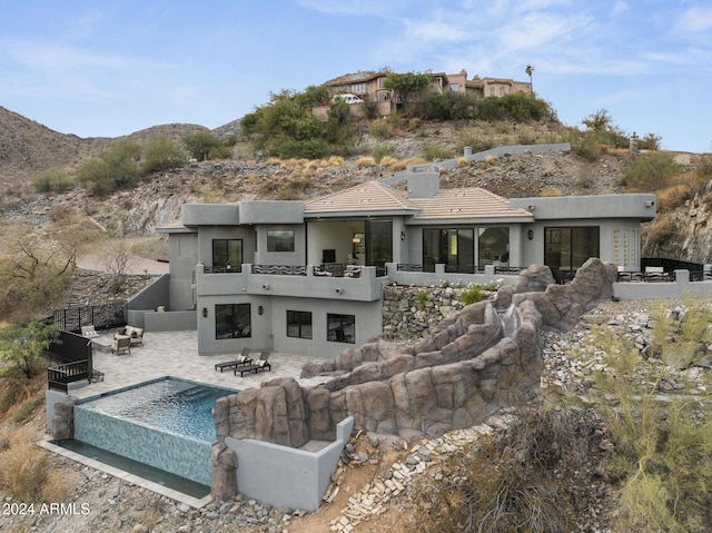 back of house featuring a patio area