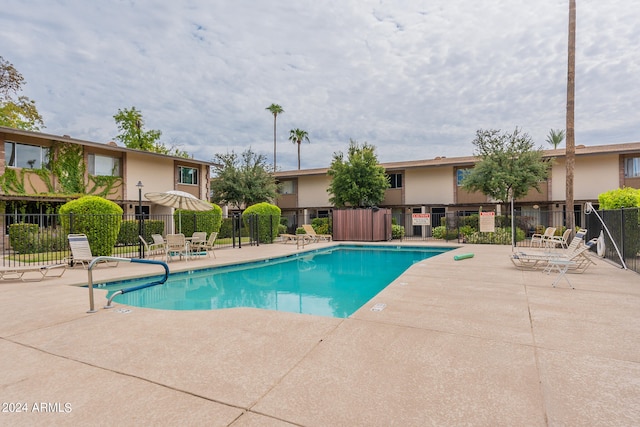 view of swimming pool featuring a patio