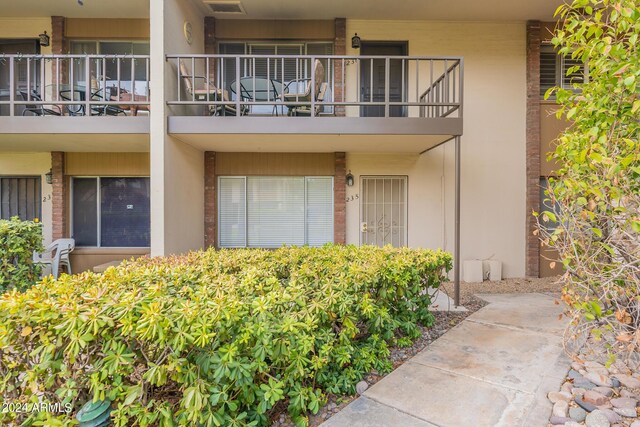 property entrance with a balcony