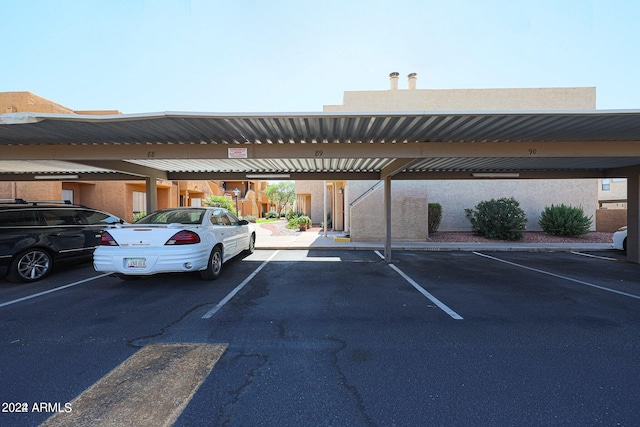 view of vehicle parking with a carport