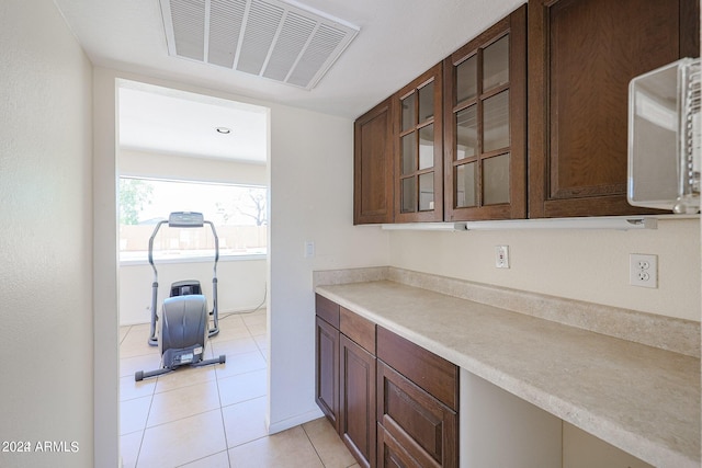 kitchen with light tile patterned floors