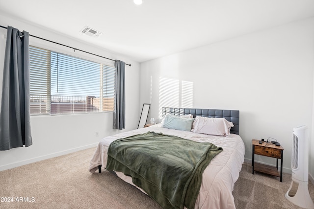 bedroom with light carpet