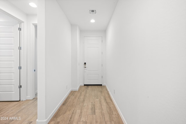 hallway featuring light hardwood / wood-style flooring