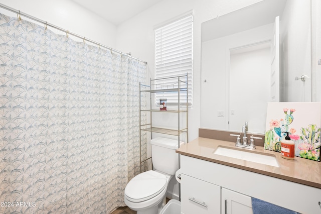 bathroom with vanity and toilet