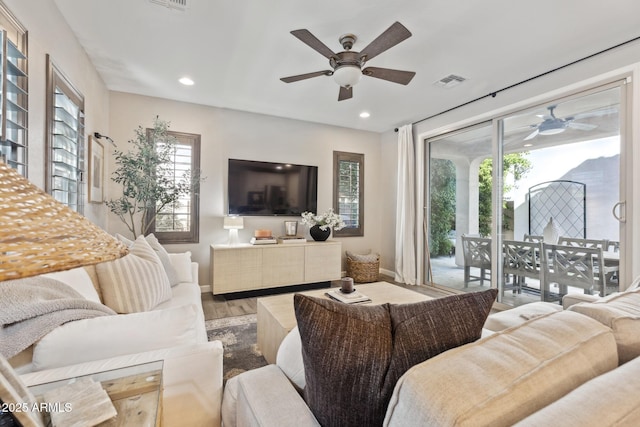 1941 W Yellowstone Way, Chandler, AZ 85248 - living area featuring a ceiling fan, wood finished floors, baseboards, and recessed lighting