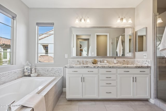 1941 W Yellowstone Way, Chandler, AZ 85248 - bathroom with double vanity, a garden tub, a stall shower, and tile patterned floors