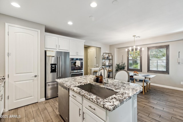 1941 W Yellowstone Way, Chandler, AZ 85248 - kitchen with appliances with stainless steel finishes, a sink, light wood finished floors, baseboards, and recessed lighting