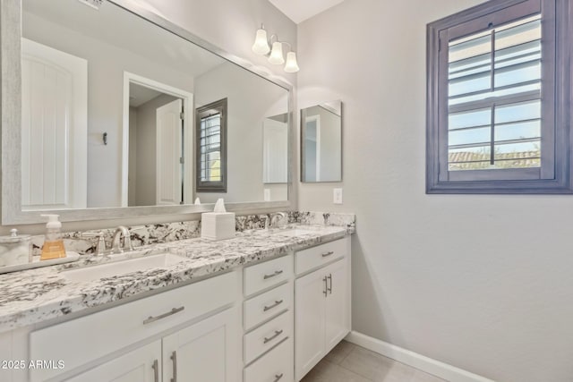 1941 W Yellowstone Way, Chandler, AZ 85248 - bathroom with baseboards, double vanity, and tile patterned floors