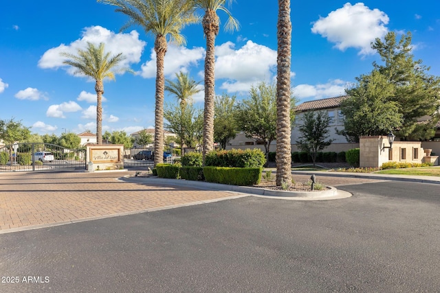 1941 W Yellowstone Way, Chandler, AZ 85248 - view of asphalt road with a gate, curbs, and a gated entry
