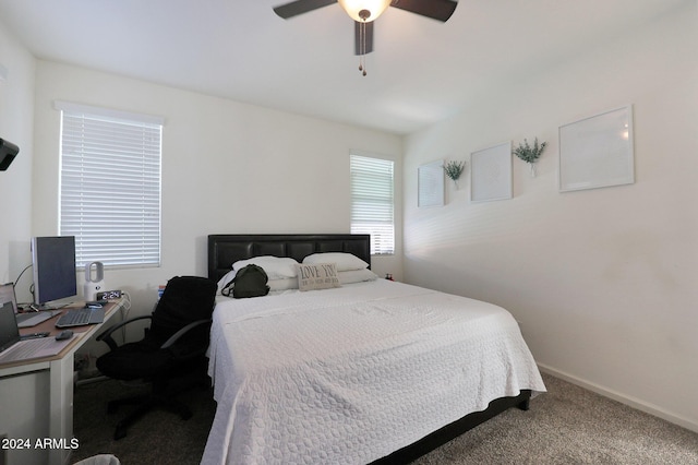 bedroom with ceiling fan and carpet floors