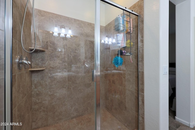 bathroom with a shower with shower door