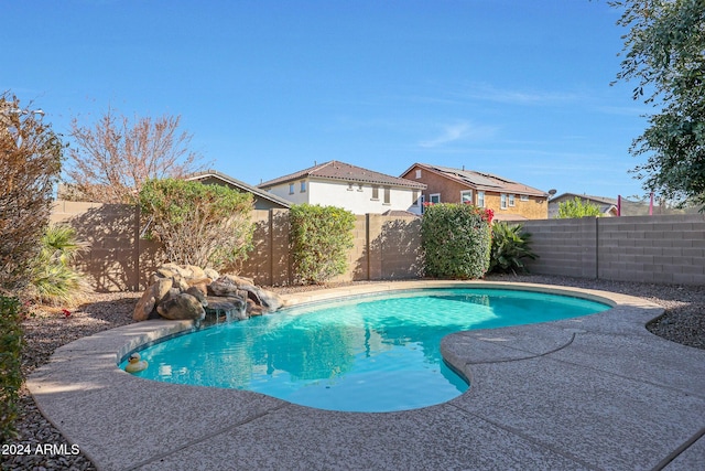 view of swimming pool featuring pool water feature