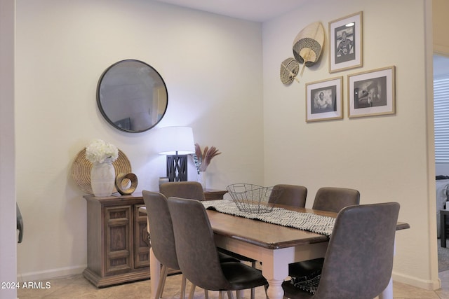 dining space with light tile patterned floors