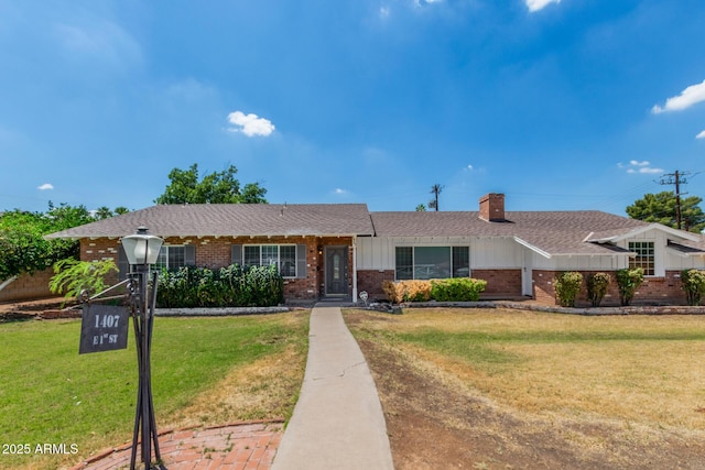 1407 E 1st St, Mesa, AZ 85203 - ranch-style home featuring brick siding, a front yard, roof with shingles, a chimney, and board and batten siding