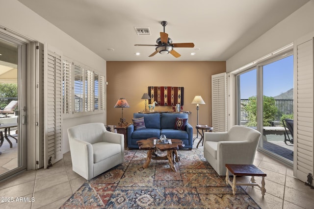 14007 E Lupine Ave, Scottsdale, AZ 85259 - tiled living room with a ceiling fan and recessed lighting