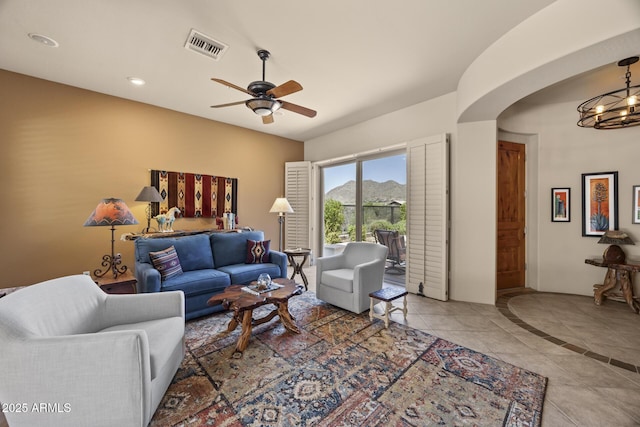 14007 E Lupine Ave, Scottsdale, AZ 85259 - tiled living room with a chandelier, a ceiling fan, arched walkways, and recessed lighting