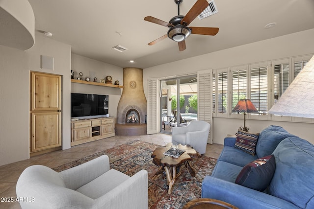 14007 E Lupine Ave, Scottsdale, AZ 85259 - living area with ceiling fan, light tile patterned floors, and a fireplace