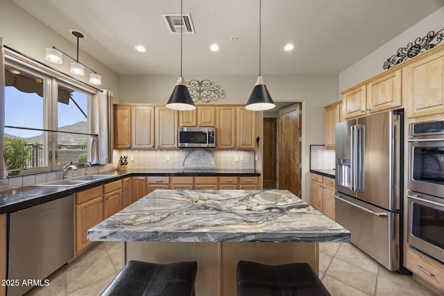14007 E Lupine Ave, Scottsdale, AZ 85259 - kitchen with appliances with stainless steel finishes, light tile patterned flooring, decorative backsplash, and recessed lighting