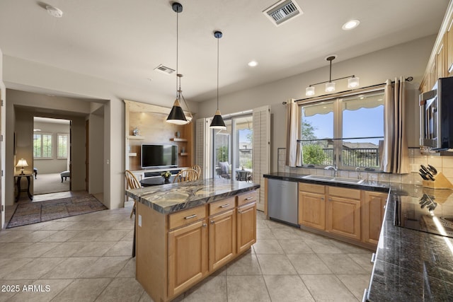 14007 E Lupine Ave, Scottsdale, AZ 85259 - kitchen featuring appliances with stainless steel finishes, plenty of natural light, decorative light fixtures, recessed lighting, and a center island