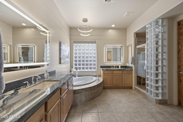 14007 E Lupine Ave, Scottsdale, AZ 85259 - full bathroom featuring two vanities, a shower stall, a bath, and recessed lighting
