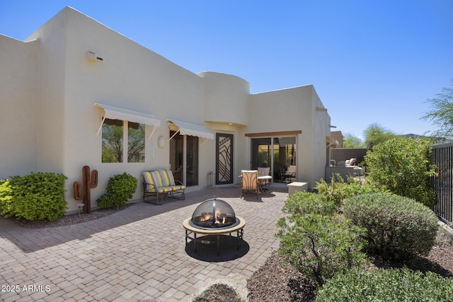 14007 E Lupine Ave, Scottsdale, AZ 85259 - back of house featuring an outdoor fire pit, stucco siding, and a patio