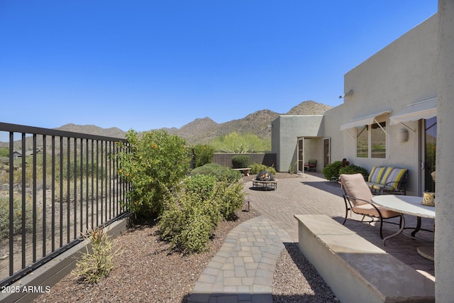 14007 E Lupine Ave, Scottsdale, AZ 85259 - view of patio with an outdoor fire pit and a mountain view