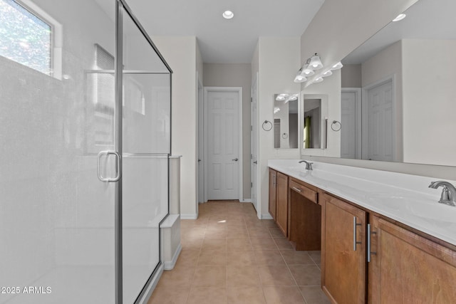 bathroom featuring an enclosed shower, vanity, and tile patterned floors