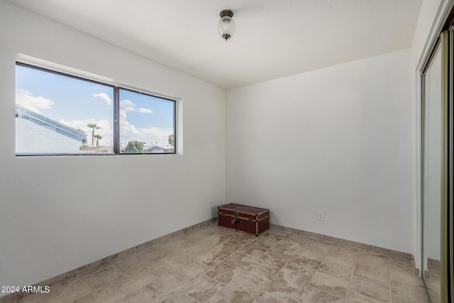 empty room with baseboards