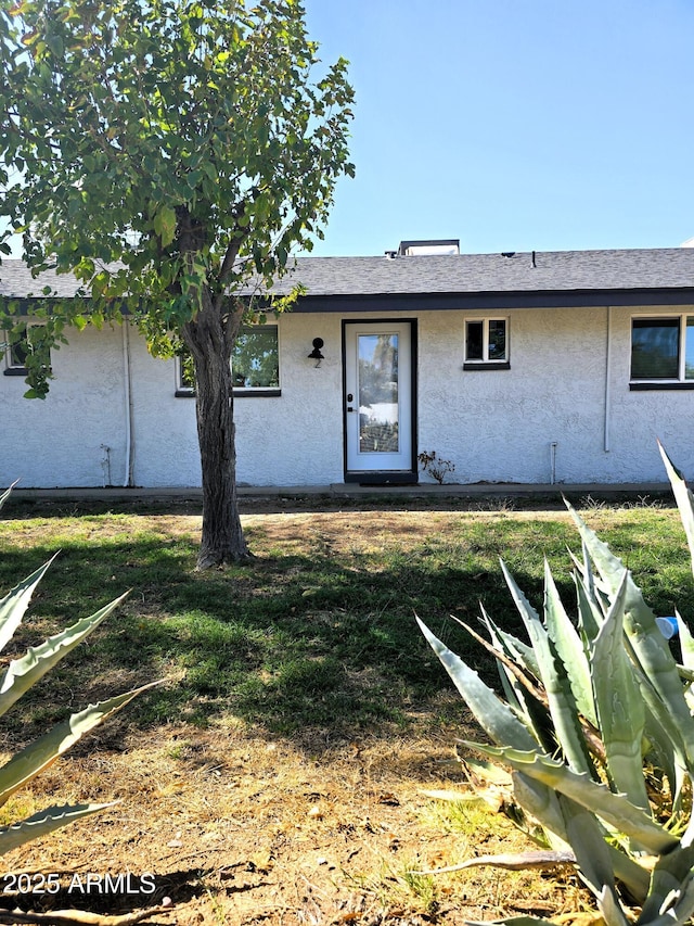4450 N Longview Ave, Phoenix, AZ 85014 - view of front facade with stucco siding and a front lawn
